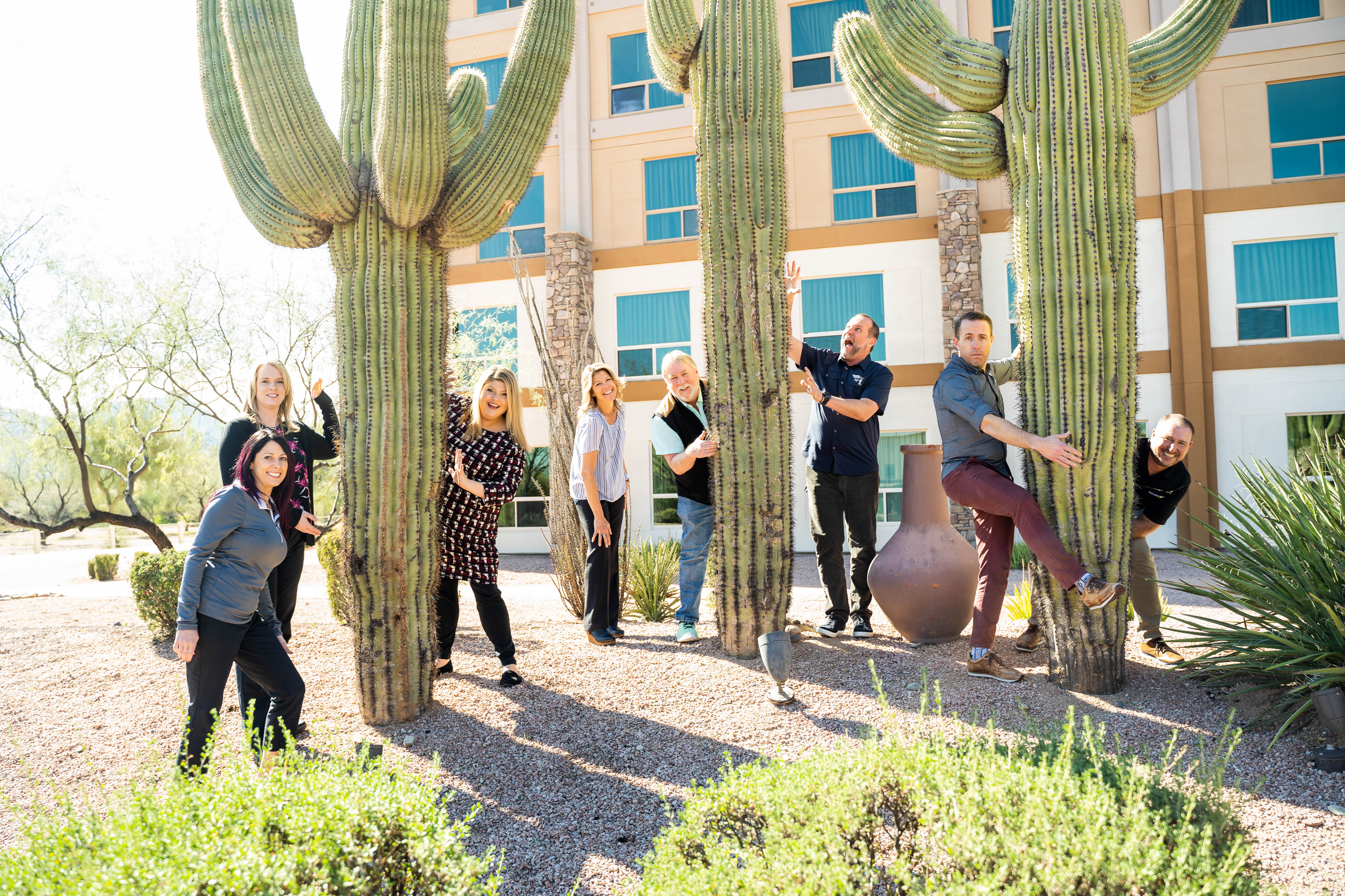 FEC Summit attendees posing with cacti.