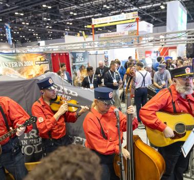 Casey and The Atta Boys performing from Silver Dollar City and Rocky Mountain Construction booth at IAAPA Expo 2023