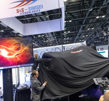 Curtain reveal for Transformers-themed axis coaster train from S&S Worldwide and SEVEN at IAAPA Expo 2023