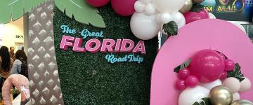 Great Florida Road Trip sign display with a palm tree and balloons.
