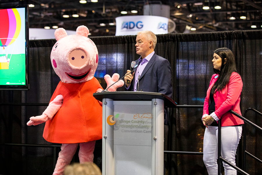 Peppa Pig on stage with the Merlin team