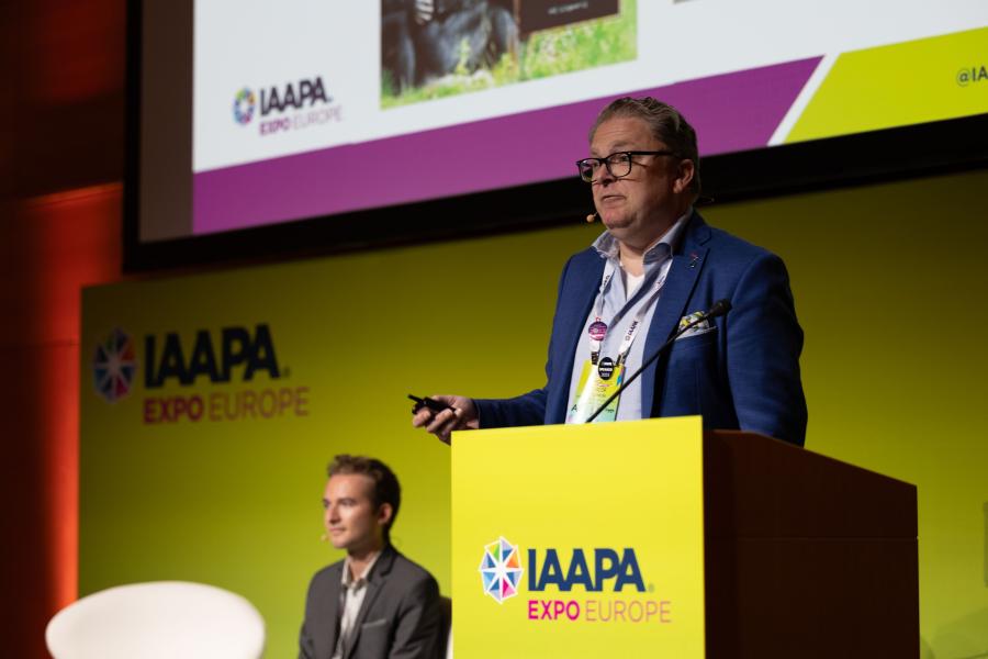Goof Lukken, a senior lecturer at Breda University of Applied Sciences, stands on a podium during F&B Innovations panel at IAAPA Expo Europe