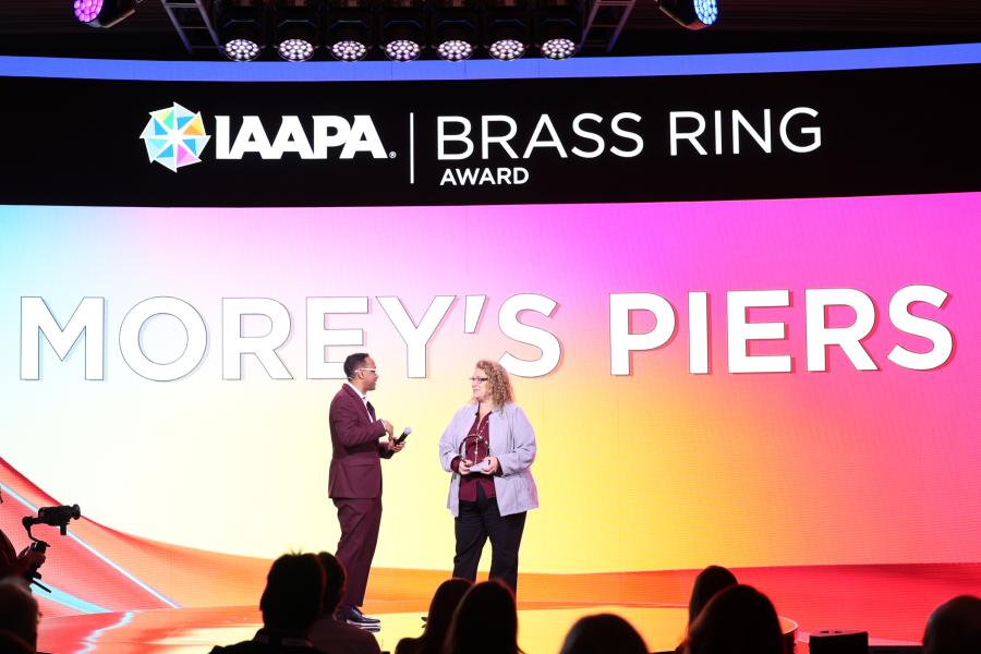 Winners of Best Outdoor Advertisement receive their awards on stage at IAAPA Honors 2024 in Las Vegas