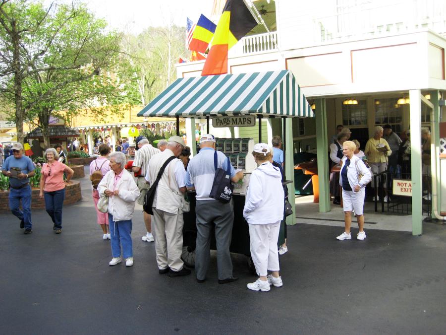 Visitors huddle together in front of the park map station at Dollywood 
