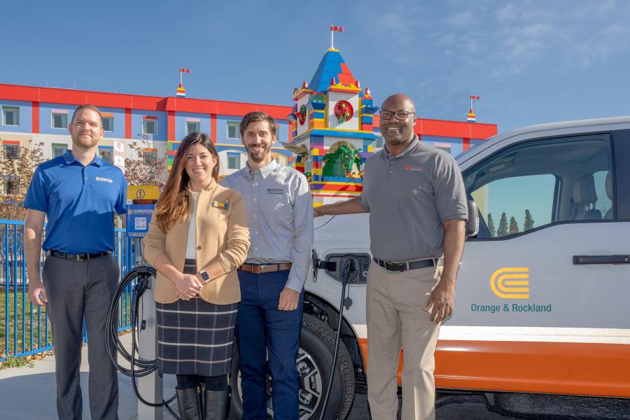 Group photo of the Legoland New York team and Livingston Energy Group celebrating a partnership for installing EV charging stations