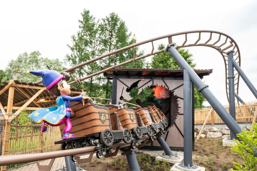 Backside view of the Fridolin's verrückter Zauberexpress roller coaster in Fantasiana Erlebnispark Straßwalchen