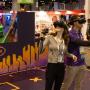 An attendee and a Spree representative try out the VR headsets