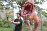 Singapore Minister ONg Ye Kung takes a selfie with T-Rex (Credit: Changi Airport Group)