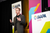 Speaker onstage at IAAPA Expo 