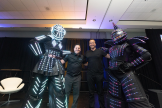 Speakers pose with performers at IAAPA Expo 