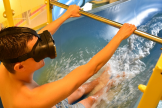 Guest wears VR headset on water slide (Provided by wiegand.waterrides GmbH)