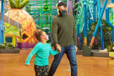 Mall of America - Nickelodeon Universe - Father and Daughter walking by huge pineaple